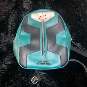 MHA backpack used in good condition with minor flaws.